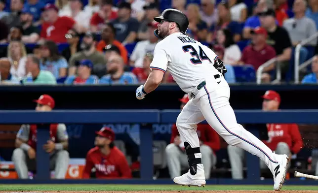 Miami Marlins' Liam Hicks (34) hits a single during the second inning of a baseball game against the Philadelphia Phillies, Saturday, May 2, 2026, in Miami. (AP Photo/Michael Laughlin)