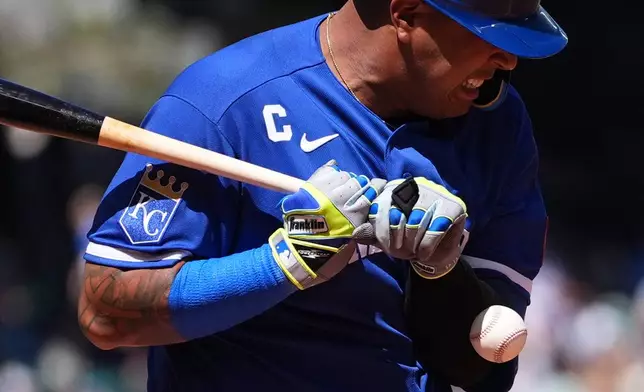 Kansas City Royals' Salvador Perez is hit by a pitch from Seattle Mariners starting pitcher Luis Castillo during the fourth inning of a baseball game, Sunday, May 3, 2026, in Seattle. (AP Photo/Lindsey Wasson)