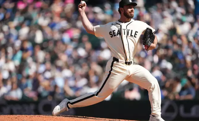 Seattle Mariners relief pitcher Nick Davila throws in his major league debut against the Kansas City Royals during the ninth inning of a baseball game, Sunday, May 3, 2026, in Seattle. (AP Photo/Lindsey Wasson)