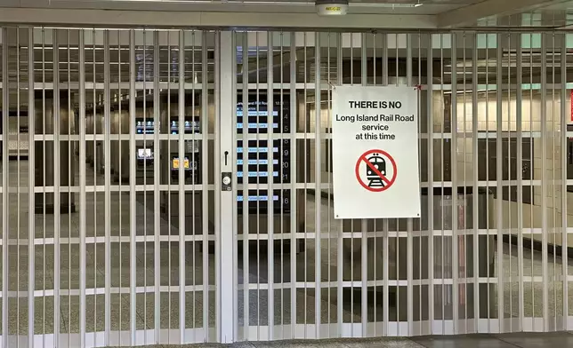 A gate blocks a corridor to Long Island Rail Road train platforms at Penn Station on the first day of a strike on Saturday, May 16, 2026 in New York. (AP Photo/Michael R. Sisak)