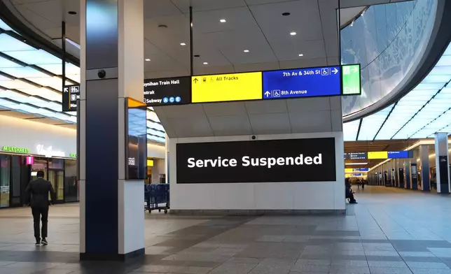 Service suspended signs are posted inside Penn Station on the first day of a Long Island Rail Road strike, Saturday, May 16, 2026, in New York. (AP Photo/Heather Khalifa)
