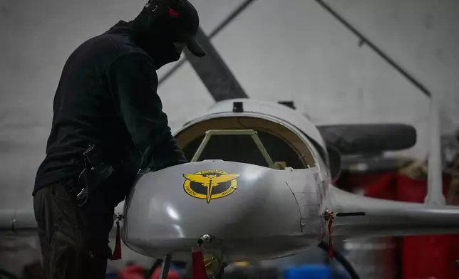 A serviceman of Ukraine's Defence Intelligence prepares an An-196 Liutyi (Fierce) one-way deep strike drone in an undisclosed location in Ukraine late Thursday, May 28, 2026. (AP Photo/Efrem Lukatsky)