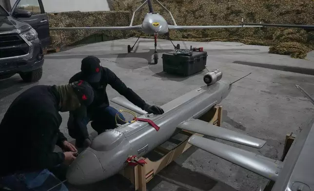 Servicemen of Ukraine's defense intelligence set up the Peklo (Hell) missile drone against Russian in an undisclosed location in Ukraine late Thursday, May 28, 2026. (AP Photo/Efrem Lukatsky)