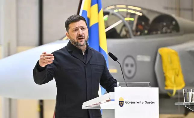 Ukraine's President Volodymyr Zelenskyy and Sweden's Prime Minister Ulf Kristersson, not seen, give a joint news conference at the F16 air flotilla in Uppsala, Sweden, Thursday, May 28, 2026. (Christine Olsson/TT News Agency via AP)