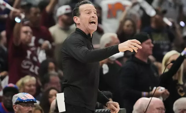 Cleveland Cavaliers head coach Kenny Atkinson yells from the sideline during the first half of Game 4 in the Eastern Conference finals NBA basketball playoffs series against the New York Knicks in Cleveland, Monday, May 25, 2026. (AP Photo/Sue Ogrocki)