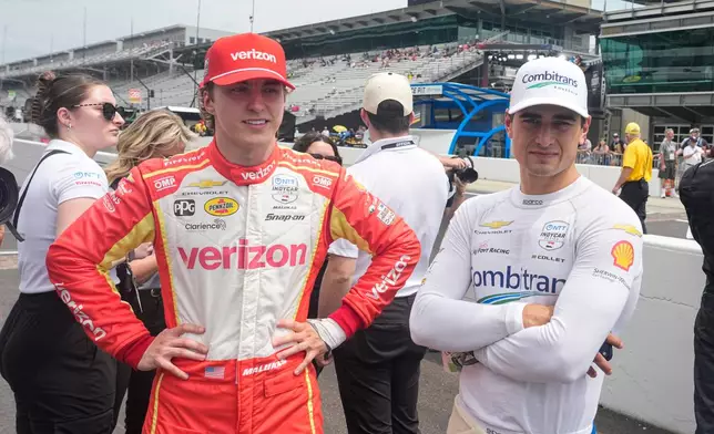 David Maluka, left, talks with Caio Collet before practice for the Indianapolis 500 auto race at the Indianapolis Motor Speedway in Indianapolis, Monday, May 18, 2026. (AP Photo/Michael Conroy)