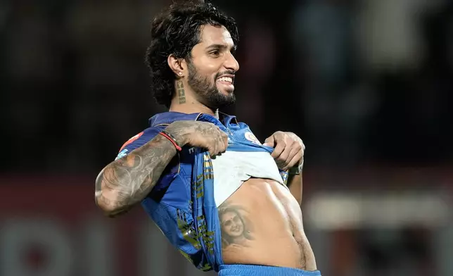Mumbai Indians' Tilak Varma celebrates after their win in the Indian Premier League cricket match against Punjab Kings in Dharamshala, India, Thursday, May 14, 2026. (AP Photo/Ashwini Bhatia)