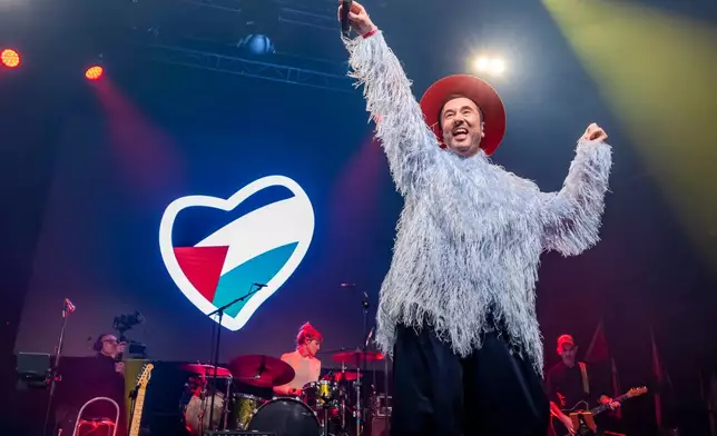 Belgian singer Gustaph sings during a United for Palestine anti-Eurovision concert in Brussels, Tuesday, May 12, 2026. (AP Photo/Geert Vanden Wijngaert)