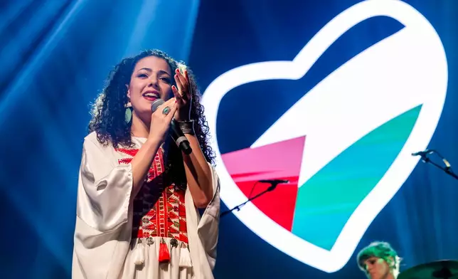 Palestinian singer-songwriter and video artis Nai Barghouti sings during a United for Palestine anti-Eurovision concert in Brussels, Tuesday, May 12, 2026. (AP Photo/Geert Vanden Wijngaert)