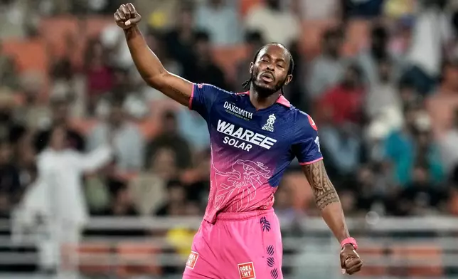 Rajasthan Royals' Jofra Archer celebrates the wicket of Sunrisers Hyderabad's Travis Head during the Indian Premier League cricket match between Rajasthan Royals and Sunrisers Hyderabad in New Chandigarh, India, Wednesday, May 27, 2026. (AP Photo/Ashwini Bhatia)