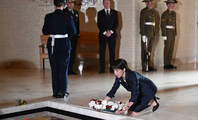 Japan's Prime Minister Sanae Takaichi lays a wreath at the Tomb of the Unknown Soldier during a visit to the Australian War Memorial in Canberra, Australia, Monday, May 4, 2026. (Lukas Coch/AAP Image via AP)