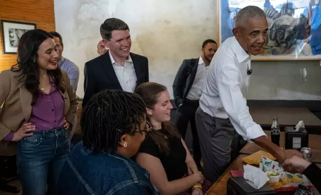 Texas Democratic gubernatorial candidate Gina Hinojosa, Texas Democratic Senate candidate and Texas state Rep. James Talarico, and former President Barack Obama visit the Taco Joint on Tuesday, May 12, 2026, in Austin, Texas. (AP Photo/Joel Angel Juarez, Pool)