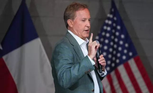 Texas Attorney General Ken Paxton, a Republican candidate for the U.S. Senate, speaks to supporters while campaigning for his primary runoff race Monday, May 18, 2026, in Dallas. (AP Photo/Julio Cortez)