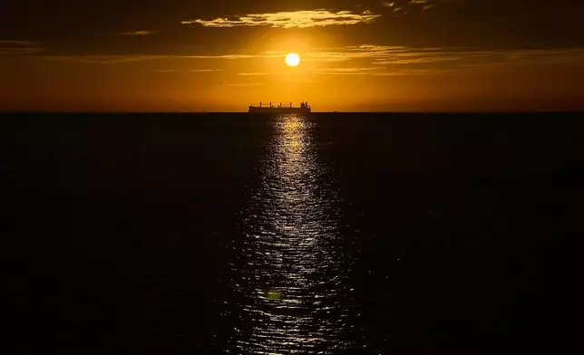 FILE - An oil vessel is visible in the Caribbean Sea at sunset during a nearby conference aimed at transitioning away from fossil fuels Tuesday, April 28, 2026, in Santa Marta, Colombia. (AP Photo/Ivan Valencia, File)