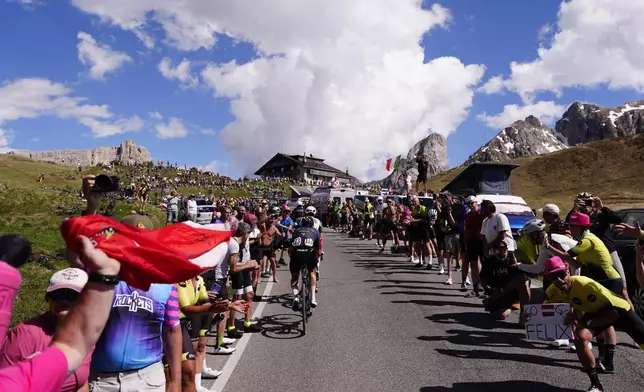 Riders pedal during the 19th stage of the Giro d'Italia cycling race, from Feltre to Alleghe, Italy, Friday, May 29, 2026. (Fabio Ferrari/LaPresse via AP)