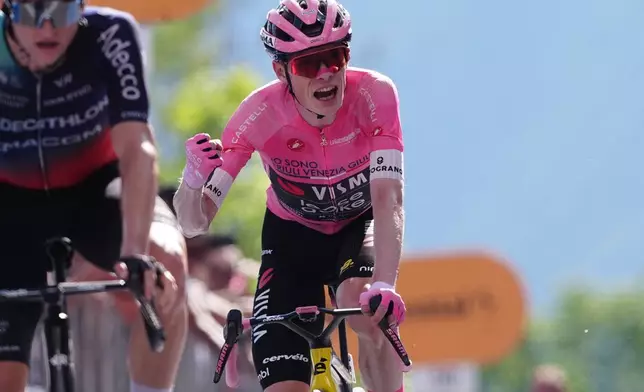 The pink jersey Denmark's Jonas Vingegaard Hansen of Team Visma | Lease A Bike reacts as he finishes the 19th stage of the Giro d'Italia cycling race, from Feltre to Alleghe, Italy, Friday, May 29, 2026. (Gian Mattia D'Alberto/LaPresse via AP)