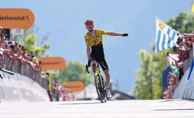United States' Sepp Kuss of Team Visma | Lease A Bike celebrates winning the 19th stage of the Giro d'Italia cycling race, from Feltre to Alleghe, Italy, Friday, May 29, 2026. (Gian Mattia D'Alberto/LaPresse via AP)