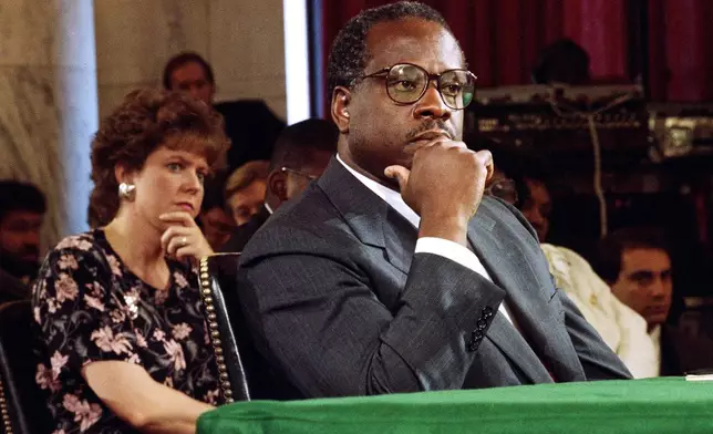 FILE - Supreme Court Justice Nominee Clarence Thomas and his wife Virginia listen during his nomination hearing before the Senate Judiciary Committee on Capitol Hill in Washington, Sept. 10, 1991. (AP Photo/Doug Mills, File)