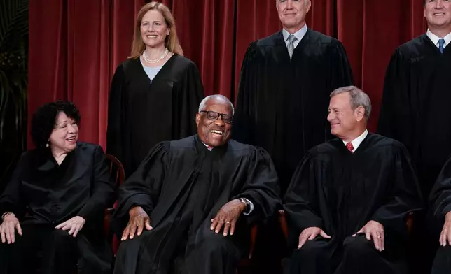 FILE - Members of the Supreme Court sit for a new group portrait following the addition of Associate Justice Ketanji Brown Jackson, at the Supreme Court building in Washington, Oct. 7, 2022. Bottom row, from left, Associate Justice Sonia Sotomayor, Associate Justice Clarence Thomas, and Chief Justice of the United States John Roberts. Top row, from left, Associate Justice Amy Coney Barrett, Associate Justice Neil Gorsuch, and Associate Justice Brett Kavanaugh. (AP Photo/J. Scott Applewhite, File)