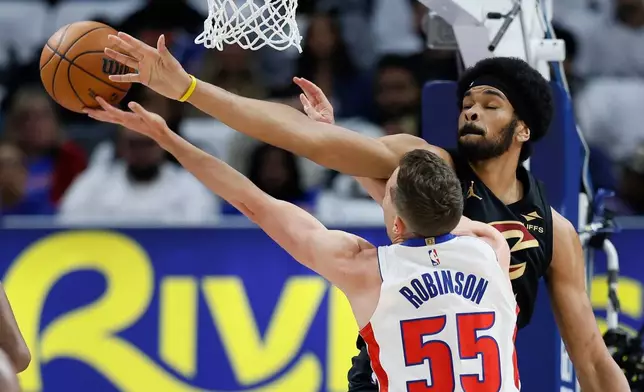 Cleveland Cavaliers center Jarrett Allen (31) defended against a shot by Detroit Pistons forward Duncan Robinson (55) during the first half in Game 1 of a second-round NBA playoffs basketball series Tuesday, May 5, 2026, in Detroit. (AP Photo/Duane Burleson)