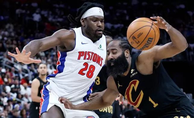 Cleveland Cavaliers guard James Harden (1) drives against Detroit Pistons forward Isaiah Stewart (28) during the first half in Game 1 of a second-round NBA playoffs basketball series Tuesday, May 5, 2026, in Detroit. (AP Photo/Duane Burleson)