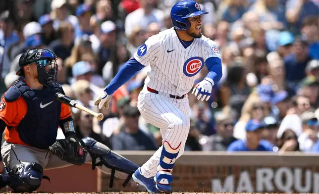 Chicago Cubs' Pedro Ramirez, right, watches his RBI double during the second inning of a baseball game against the Houston Astros in Chicago, Sunday, May 24, 2026. (AP Photo/Paul Beaty)