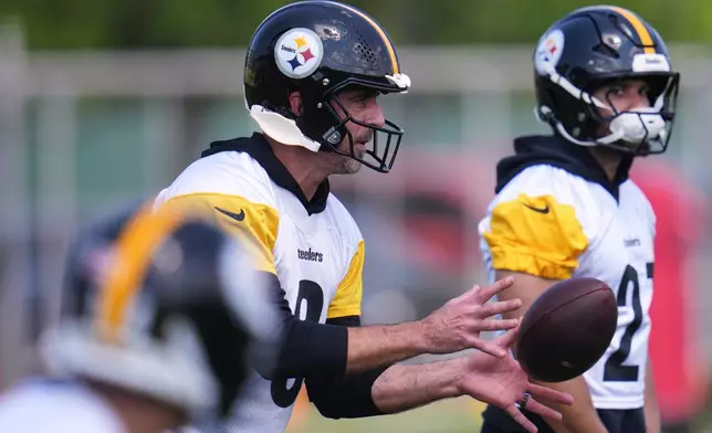 Pittsburgh Steelers quarterback Aaron Rodgers (8) participates in the football team's OTA workout in Pittsburgh, Monday, May 18, 2026. (AP Photo/Gene J. Puskar)