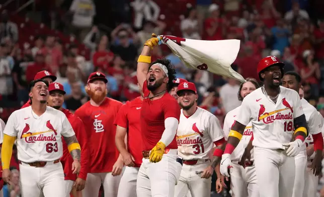St. Louis Cardinals' Ivan Herrera celebrates after hitting a three-run walk-off home run to defeat the Pittsburgh Pirates in the 10th inning of a baseball game Tuesday, May 19, 2026, in St. Louis. (AP Photo/Jeff Roberson)