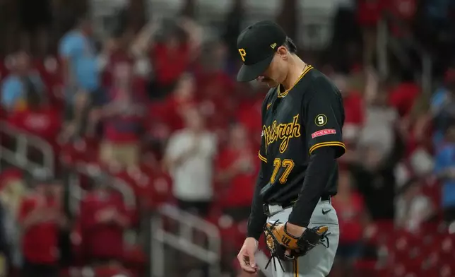 Pittsburgh Pirates pitcher Brandan Bidois pauses after giving up a solo home run to St. Louis Cardinals' Alec Burleson during the eighth inning of a baseball game Tuesday, May 19, 2026, in St. Louis. (AP Photo/Jeff Roberson)