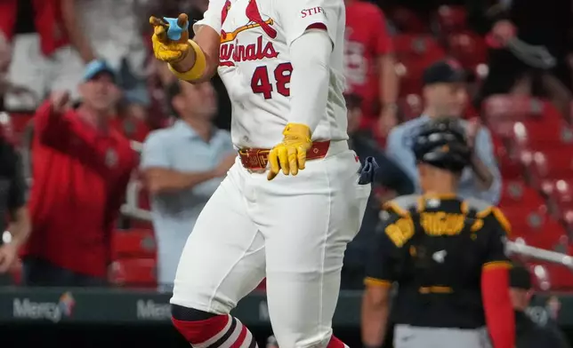 St. Louis Cardinals' Ivan Herrera celebrates after hitting a three-run walk-off home run to defeat the Pittsburgh Pirates in the 10th inning of a baseball game Tuesday, May 19, 2026, in St. Louis. (AP Photo/Jeff Roberson)