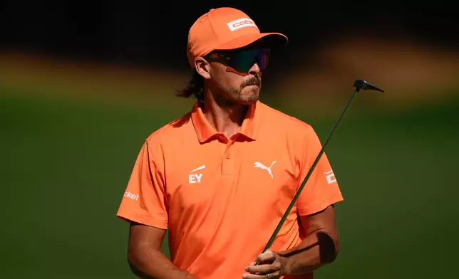 Rickie Fowler walks on the 15th hole during the final round of the Truist Championship golf tournament at the Quail Hollow Club, Sunday, May 10, 2026, in Charlotte, N.C. (AP Photo/Chris Carlson)