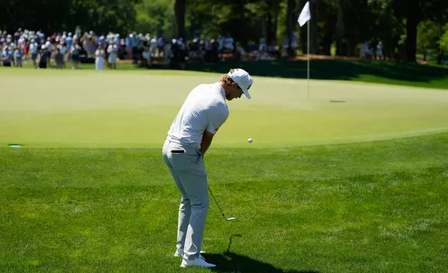 Kristoffer Reitan, of Norway, chips on to the green on the fifth hole during the final round of the Truist Championship golf tournament at the Quail Hollow Club, Sunday, May 10, 2026, in Charlotte, N.C. (AP Photo/Chris Carlson)