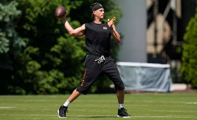 Cincinnati Bengals quarterback Joe Burrow throws during NFL football practice, Tuesday, May 12, 2026, in Cincinnati. (AP Photo/Jeff Dean)