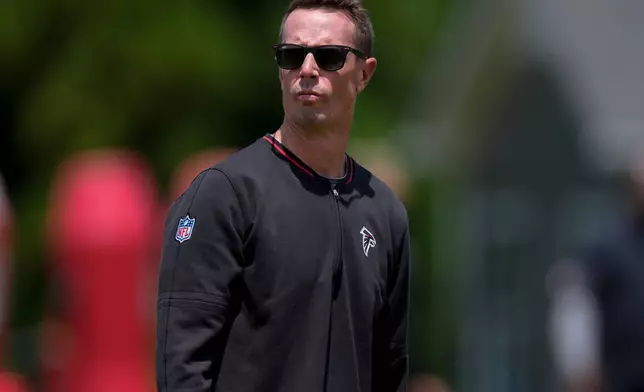 Atlanta Falcon's President of Football, Matt Ryan watches players during an NFL football rookie mini camp, Friday, May 8, 2026, in Flowery Branch, Ga. (AP Photo/Mike Stewart)