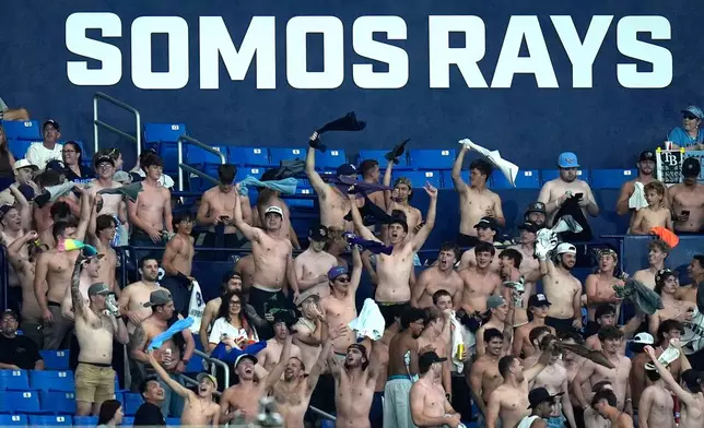 Tampa Bay Rays fans cheer on the team during the eighth inning of a baseball game against the Baltimore Orioles Monday, May 18, 2026, in St. Petersburg, Fla. (AP Photo/Chris O'Meara)