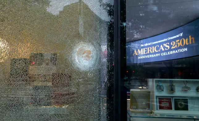 Bullet holes and shattered glass remain at The People's House, Sunday, May 24, 2026, in Washington after the U.S. Secret Service shot a person near the White House on Saturday. (AP Photo/Rod Lamkey, Jr.)