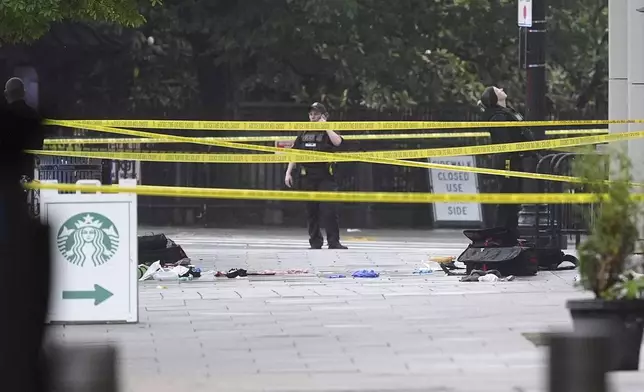 An EMS kit and gloves are pictured on the ground where police and Secret Service blocked streets around the White House, Saturday, May 23, 2026, in Washington. (AP Photo/Alex Brandon)