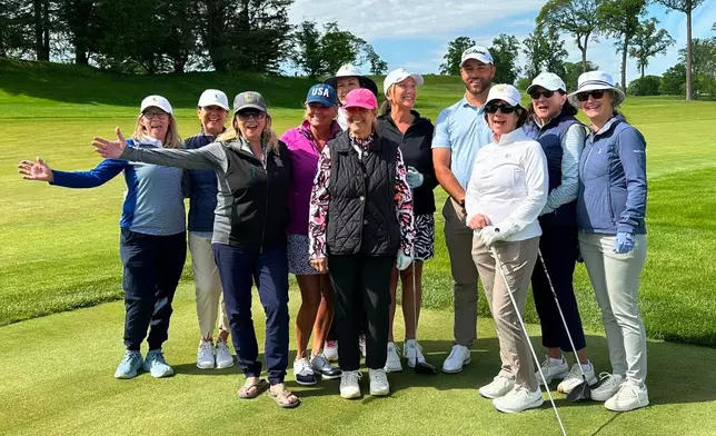 Braden Shattuck, a club professional who qualified to play in this weekend's PGA Championship at Aronimink Golf Club, poses with golfers during a women's clinic at Rolling Green Golf Club, Wednesday, May 13, 2026, in Springfield, Pa. (AP Photo/Dan Gelston)