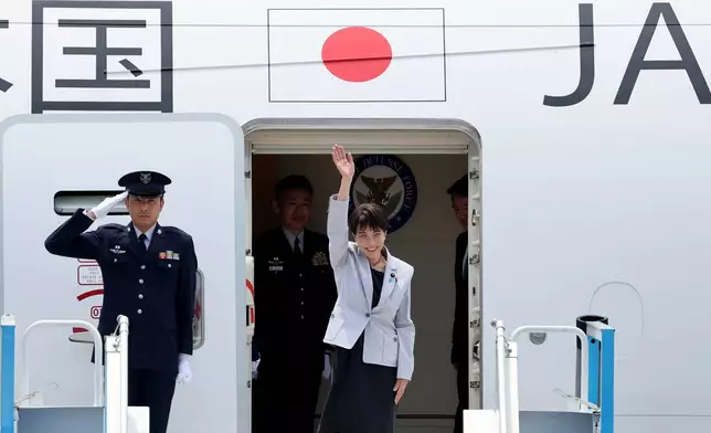 Japan's Prime Minister Sanae Takaichi waves upon arrival at the Daegu International Airport in Daegu, South Korea, Tuesday, May 19, 2026. (Yoon Kwan-shick/Yonhap via AP)