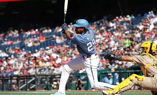Washington Nationals' James Wood singles during the first inning of a baseball game against the San Diego Padres, Saturday, May 30, 2026, in Washington. (AP Photo/Daniel Kucin Jr.)