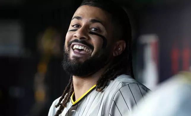San Diego Padres' Fernando Tatis Jr. celebrates after hitting a home run during the fifth inning of a baseball game against the Washington Nationals, Saturday, May 30, 2026, in Washington. (AP Photo/Daniel Kucin Jr.)