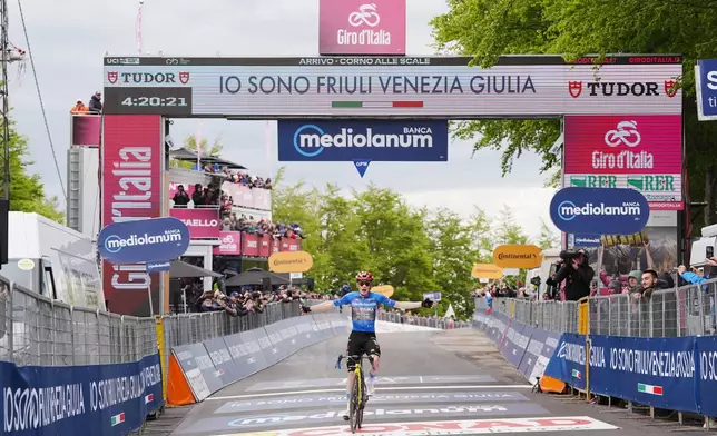 Denmark's Jonas Vingegaard celebrates winning stage 9 of the Giro d'Italia cycling race, from Cervia to Corrno alle Scale, Italy, Sunday May 17, 2026. (Massimo Paolone/LaPresse via AP)
