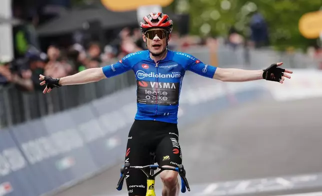 Denmark's Jonas Vingegaard celebrates winning stage 9 of the Giro d'Italia cycling race, from Cervia to Corrno alle Scale, Italy, Sunday May 17, 2026. (Gian Mattia D'Alberto/LaPresse via AP)