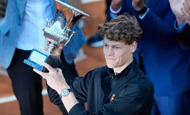 Jannik Sinner, of Italy, holds his trophy after defeating Casper Ruud, of Norway, 6/4, 6/4 in the final match to win the Italian Open tennis tournament, in Rome, Sunday, May 17, 2026.(AP Photo/Alessandra Tarantino)