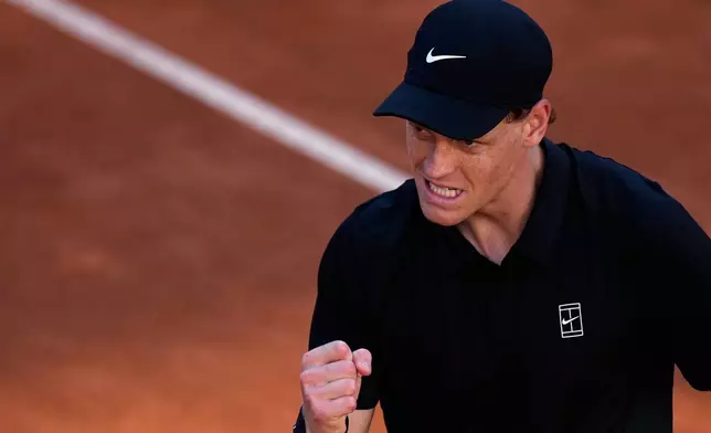 Jannik Sinner, of Italy, celebrates winning a point against Casper Ruud, of Norway, during the final match at the Italian Open tennis tournament, in Rome, Sunday, May 17, 2026. (AP Photo/Alessandra Tarantino)