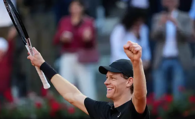 Jannik Sinner, of Italy, celebrates after defeating Casper Ruud, of Norway, 6/4, 6/4 in the final match at the Italian Open tennis tournament, in Rome, Sunday, May 17, 2026. (AP Photo/Andrew Medichini)