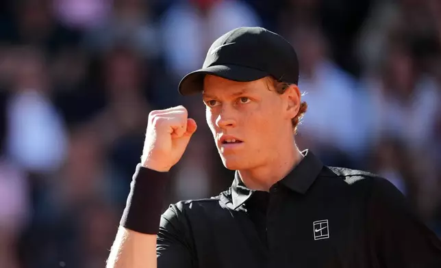 Jannik Sinner, of Italy, celebrates winning a point against Casper Ruud, of Norway, during the final match at the Italian Open tennis tournament, in Rome, Sunday, May 17, 2026. (AP Photo/Andrew Medichini)