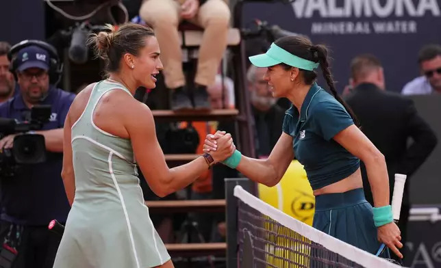 Romania's Sorana Cirstea, right, and Belarus' Aryna Sabalenka react at the end of the match at the Italian Open tennis tournament in Rome, Saturday, May 9, 2026. (AP Photo/Alessandra Tarantino)