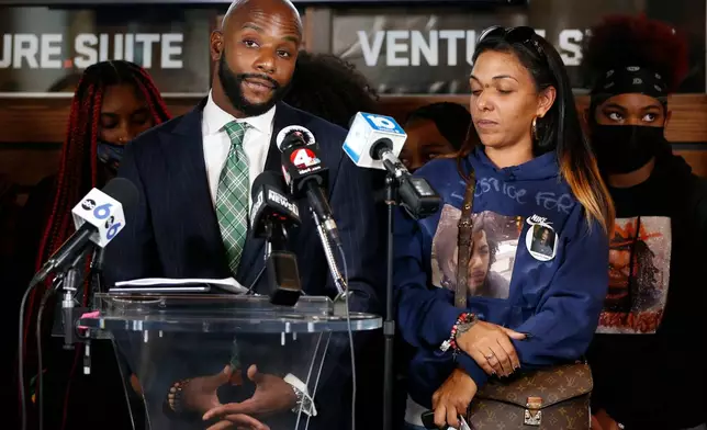 FILE - Sean Walton, left, attorney representing Tamala Payne, right, the mother of Casey Goodson Jr., speaks during a news conferenc, Dec. 2, 2021, in Columbus, Ohio. (AP Photo/Jay LaPrete)