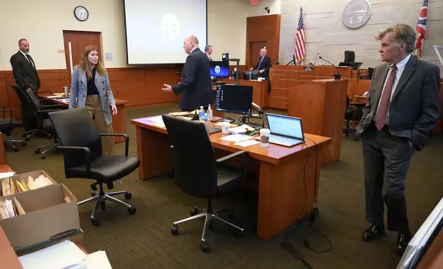 From left, former sheriff's deputy Jason Meade, defense attorney Kaitlyn Stephens, prosecutor Howard Tim Merkle and prosecutor Gary Shroyer stand inside the courtroom at Franklin County Court of Common Pleas on Wednesday, May 6, 2026, in Columbus, Ohio. (Doral Chenoweth/The Columbus Dispatch via AP, Pool)